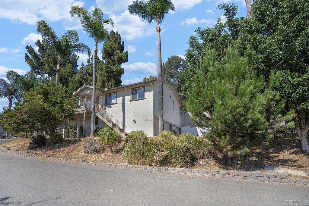 Discover this 3 bedroom home in the desirable Winter Gardens area, tucked away on a private road with stunning mountain views. The expansive living area flows seamlessly throughout, offering a comfortable layout for both everyday living and entertaining. This home is equipped with a brand new air conditioning unit and furnace, along with solar panels to help offset your electric bill, giving you comfort and efficiency year round. The property sits on a generous lot with plenty of outdoor space, ideal for planting trees, gardening, or future expansion. The large yard is also well suited for storing recreational vehicles, boats, or other toys. Additional features include a massive crawl space with unlimited potential and a 3 car garage that provides ample storage and flexibility. This home offers privacy, views, and the space to make it your own.
