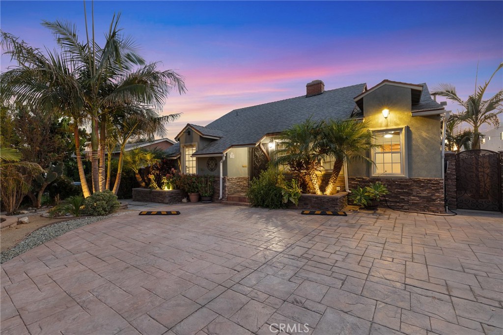 A hidden gem, located in North Hollywood, is hitting the market after decades of cherished ownership. This lovely 3-bedroom, 3-bathroom home with an additional office boasts a generous layout, versatile design, and character.
You’re greeted by a large front driveway with ample parking and enchanting landscaped curb appeal. The living and dining areas are perfect for relaxing evenings or lively gatherings with family and friends. The home office offers flexibility, which can serve as a creative space or a playroom for children.
The expansive backyard is your own private retreat with mature greenery, a charming pergola that adds both shade and ambiance, and two multifunctional bonus rooms — perfect for a home gym, art studio, or whatever your heart desires. A dedicated laundry room adds convenience, keeping the home’s main living areas open and uncluttered. The detached two-car garage provides generous storage, complemented by an additional storage area and a secondary long driveway with private rear access.
This move-in-ready property, along with its generous lot size, presents incredible ADU potential. A few photos have been enhanced with virtual staging, and a wall color change was added to one of the bedrooms. Whether you're looking to expand, invest, or simply live with more space and comfort, this home demonstrates endless possibilities for growth and transformation.