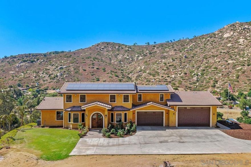 Newly constructed in 2021, this sprawling estate boasts 5+ acres and has been meticulously design-built to blend spaciousness and functionality. This property is nestled in the mountains of prestigious Old Coach Estates and just a stone's throw away from award winning Maderas Golf Course. Breathtaking 360-degree views of the surrounding mountains create an ideal backdrop for gatherings, quiet relaxation and much needed privacy to escape the fast pace of today. Every detail of this custom-built home exudes craftsmanship and elegance making it a haven for those who appreciate the finer things in life. Upon entering, you are greeted by an expansive interior where no expense has been spared. Zoned AC ensures comfort year-round, complemented by the efficiency of paid-for solar panels. A dual-function fireplace offers both gas and wood-burning options adding warmth and charm to the upstairs living spaces. The lower level is a paradise for entertainment and relaxation. A fully built-out basement features three generously sized bedrooms, a large wet bar, and LaCantina doors which seamlessly merge indoor and outdoor living. The gourmet kitchen boasts Viking appliances, a LaCantina window, granite sink, spacious island and two bar seating areas perfect for culinary aficionados and social gatherings alike. Whether tending your horses or utilizing the rolling hills to string vineyards, the quiet country setting will not disappoint. Car enthusiasts and hobbyists will delight in the oversized 6-car garage and no HOA! Note: Active permit for a pool is pulled and ready to go.  Newly constructed in 2021, this sprawling estate boasts 5+ acres and has been meticulously design-built to blend spaciousness and functionality.  This property is nestled in the mountains of prestigious Old Coach Estates and just a stone's throw away from award winning Maderas Golf Course. Breathtaking 360-degree views of the surrounding mountains create an ideal backdrop for gatherings, quiet relaxation and much needed privacy to escape the fast pace of today. Every detail of this custom-built home exudes craftsmanship and elegance making it a haven for those who appreciate the finer things in life. Upon entering, you are greeted by an expansive interior where no expense has been spared. Zoned AC ensures comfort year-round, complemented by the efficiency of paid-for solar panels. A dual-function fireplace offers both gas and wood-burning options adding warmth and charm to the upstairs living spaces. The lower level is a paradise for entertainment and relaxation. A fully built-out basement features three generously sized bedrooms, a large wet bar, and LaCantina doors which seamlessly merge indoor and outdoor living. The gourmet kitchen boasts Viking appliances, a LaCantina window, granite sink, spacious island and two bar seating areas perfect for culinary aficionados and social gatherings alike. Whether tending your horses or utilizing the rolling hills to string vineyards, the quiet country setting will not disappoint. Car enthusiasts and hobbyists will delight in the 6-car garage with an impressive 38-foot depth and an 11x18-foot door, offering ample space for vehicles, RVs & storage. No HOA! Active permit for a pool is pulled and ready to go. Potential for a workshop, ADU, barn, tennis court and more. Additional features include tank-less water heater, 3 furnaces, fire sprinklers, stucco and tile roof for durability, energy efficient Marvin windows, timeless knotty alder doors & colored concrete floors downstairs for a stylish finish. Experience the pinnacle of modern living with Starlink internet capability for reliable connectivity. Plantation shutters and rod iron accents add a touch of sophistication. Don't miss the opportunity to make this exceptional Poway estate your new home, where luxury meets comfort in every detail. Schedule your private tour today and envision the lifestyle that awaits in this unparalleled residence.