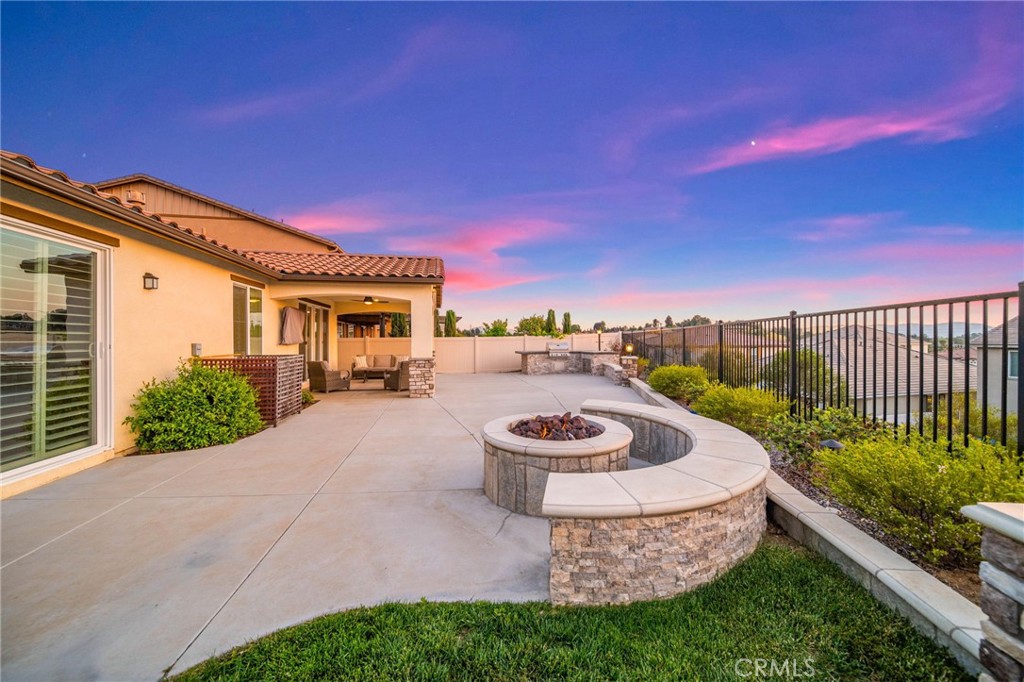 This rare single-story 4 bed, 3 bath home sits at the end of a quiet cul-de-sac in the gated Nicolas Heights community. With no neighbors on one side and stunning sunset-facing views, the backyard is built for entertaining—featuring a custom fire pit, built-in BBQ, large patio, and DG sport court and a massive yard space perfect for games and gatherings.(Or perhaps a pool) Inside, enjoy a bright open layout with a spacious kitchen that includes stainless steel appliances, double ovens, walk-in pantry, and an oversized island. Two large primary suites offer flexible living—ideal for guests or multigenerational needs. Just minutes from Temecula’s top wineries, shopping, and freeways—this home is the total package for privacy, comfort, and outdoor living!! Let's not forget the home comes with a whole house fan and solar!