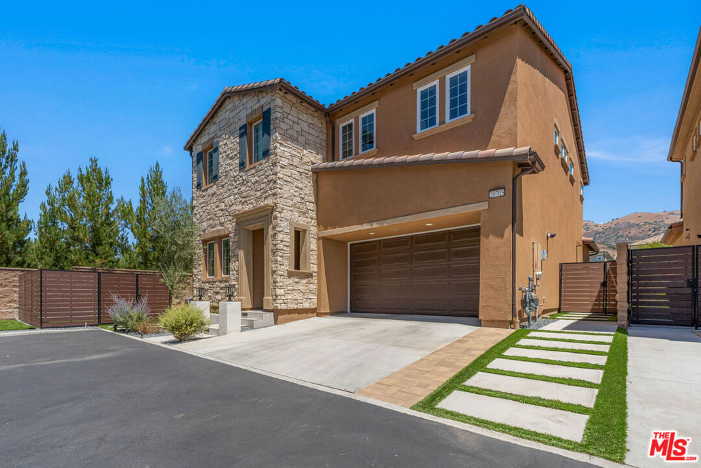The BEST lease opportunity in the Canyons Community! This stunning, newly-built residence in ideally positioned within this exclusive 24-hour guard-gated community. Featuring 5 spacious bedrooms, 5 beautifully appointed bathrooms as well as a Loft area, this home boasts an open-concept layout with high ceilings, upscale finishes, and abundant natural light throughout. Some of the many highlights include: * First floor bedroom * Gorgeous center island with custom soapstone countertops * Jenn Air Stainless Appliance Suite: Double Oven, 4 burner cooktop w/griddle, canopy hood, & dishwasher * Upgraded, floor to ceiling kitchen cabinetry with glass display doors * Solar * Charge Point Car Charging Station * Side-by-Side Front Loading Washer & Dryer * Stacking sliding glass doors....and sooo much more! Step outside to a HUGE, private wrap-around backyard complete with a custom putting green, turf lawn play area, and concrete patio decking. Additionally, you'll enjoy access to the best resort-style recreation center in all of Porter Ranch complete with a beach-entry pool, splash pad, multiple spas, outdoor TVs, and a fully equipped cooking area. Located near the award-winning Porter Ranch Community School and the brand-new Porter Ranch Community Park, and just minutes from scenic trails and The Vineyards shopping center with premier dining and retail options.