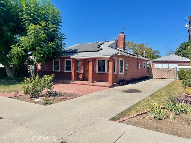 Hurry! The price has just been reduced $24,950, it's priced to sell. Don't miss this opportunity! This excellent family home features an exterior with beautiful curb appeal with mature landscaping, brick accents, and a long concrete driveway which leads to a two car detached garage with plenty of off-street parking. The interior has a formal living room with a custom floor to ceiling brick fireplace. The huge kitchen has been remodeled with tons of quality cabinets. Note:There are two separate pantries, granite counters, double electric "Professional Series" ovens, and plenty of room for dining. The master bedroom has a private bathroom. The home also has central refrigeration and heating, upgraded windows, and solar power. There is also a very large screened in lanai perfect for a game room or gym. Outside is a beautiful backyard with mature landscaping, a brick patio, and block-wall fencing. Note: The solar system will be paid-off at the close of escrow!