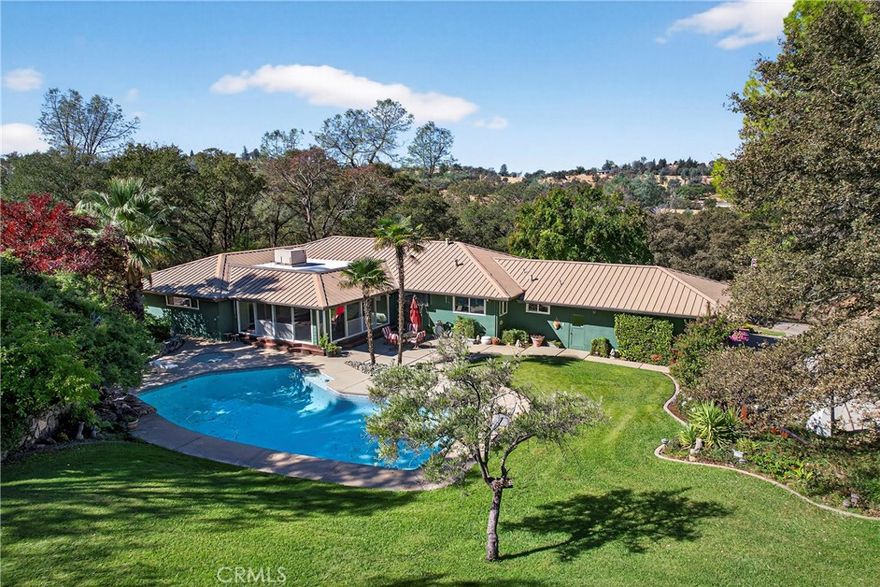 Two Homes, Two Parcels – Your Foothill Retreat Awaits! 



Discover an incredible opportunity in the lower foothills of Oroville, just minutes from Lake Oroville and the Oroville Dam. This unique property includes two separate parcels totaling 7.5 acres of scenic oak trees and lush landscaping — perfect for multi-family living, rental income, or your own private getaway.



The main home offers 3 bedrooms, 2 bathrooms, plus an office across 2,232 sq. ft. of comfortable living space. Enjoy a spacious floor plan with a cozy fireplace, an enclosed patio overlooking the in-ground swimming pool and hot tub, an attached garage, and a detached garage/workshop for all your projects.



The second parcel features a 2 bedroom, 2 bathroom manufactured home with an attached garage and an impressive 40x80 foot mechanic’s shop — ideal for mechanics, carpenters, or anyone who needs serious workspace. Sitting on 2.5 acres, it offers both privacy and potential.



This property feels like a beautiful vacation retreat you can call home — offering space, serenity, and endless possibilities.



There are two other parcels available to purchase, see last photo.



Don’t miss this rare dual-parcel opportunity — call today to schedule your private showing!
