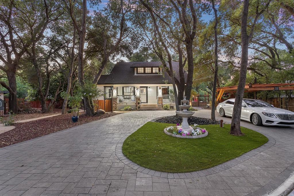 This newly renovated 4,531± sf + 300± sf ADU home on .92 acres, near the downtown of the City of Saratoga, offers todays modern amenities & style with the bygone era of Craftsman architecture. The property benefits from reduced property taxes through the Mills Act. Very few properties come to market with the charm and character of Higginbotham House. The serene & peaceful setting, set amongst the live oak trees and Saratoga Creek, creates a spiritual & tranquil effect upon one's soul. This home offers 6 bedrooms & 4 full bathrooms plus a separate ADU/rustic studio with full bath & kitchenette above a spacious workshop, which is perfect for the hobby enthusiast. The main floor plan offers a kitchen/great room experience centered among indoor & outdoor dining areas, outdoor kitchen, & the Great Hall. The primary suite is spacious & tranquil on the 2nd floor, nestled among the trees offering fantastic vistas. Three additional bedrooms & bath sit across the roof deck from the primary suite. A second kitchen, living area, bedroom, bathroom, & private deck sit at the rear of the house. Being only the 3rd owner of this storied property, the seller has revitalized the original amphitheater, 2-foot narrow gauge railway & train station.