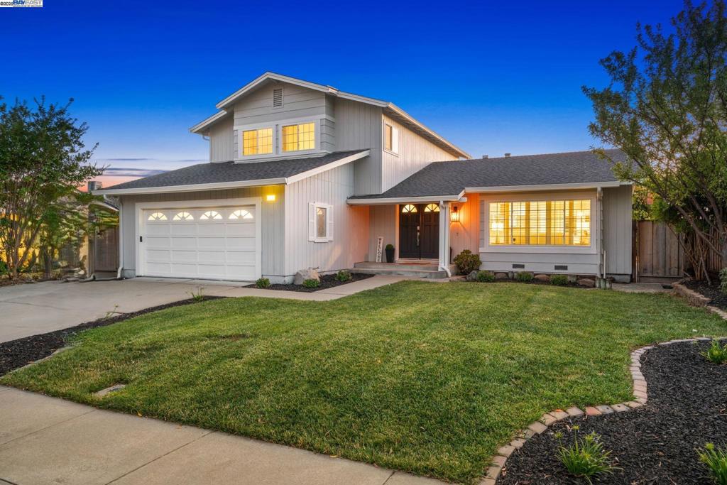 Nestled in one of Dublin's most cherished family-friendly neighborhoods, this beautifully remodeled East-facing home offers serene hillside views from every room and backs to peaceful open space and includes a bedroom and full bathroom downstairs. Remodeled in 2018, this sun-drenched residence features generous living areas, including a formal living room, family room, and dining area—ideal for everyday comfort and entertaining. The gourmet kitchen with a view is a showstopper, sure to impress even the most discerning chef, boasting sleek granite countertops, stainless steel appliances, shiny backsplash, updated white cabinetry, and a gas cooktop. Thoughtful upgrades and modern finishes include stylish laminate flooring, dual-pane windows, an elegant electric fireplace, and a beautifully updated primary bathroom vanity. Energy efficiency is enhanced by a fully owned solar system. Step outside to enjoy stunning sunset views, mature fruit trees, and nearby open space. Outdoor enthusiasts will appreciate direct access to the Iron Horse and Alamo Creek Trails, and the Dougherty Hills Open Space. Kids can easily walk or bike to Dublin’s top-rated schools, and Stagecoach Park and Dougherty Hills Dog Park are just steps away. Commuters will love the quick access to 580, 680, and BART.