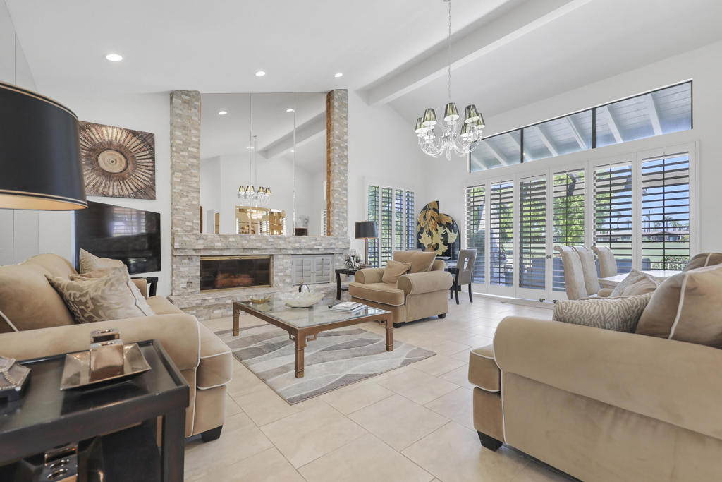 This TUCSON plan is luxury living at its best; over 2700 sq ft with 3 bedroom suites plus powder room, Formal Living Room, Separate Dining Room, Family room and built-in Wall Fountain. Its corner location affords Mountain and Double Fairway views with a glimpse of the lake fountain . The primary is large and bright with pitched ceilings, 2 walk in closets and oversized bath with spa tub , separate shower ,enclosed commode and plenty of counter space. The third bedroom is used by many as an extra large denwith shutters that can be opened to the public areas. The stone fireplace and hearth are focal points in the living room and only matched by the views to the outside through 2 '' walls'' of glass . Enjoy cocktails at the sit down bar with room for four. The kitchen family room has counter seating plus a breakfast area - again with lovely views. Seven (7) skylights throughout the home keep everything light and bright.The Corner Patio is one of the largest in the club with built-in BBQ and room for plenty of furniture, Sit and enjoy sunsets to the west with snow peaks in winter. The Lakes has 902 homes and in 2020 completed extensive enhancements that set it above most of the valley clubs .An active golf club (Ted Robinson designed 27 holes) and and 23 courts --Pickleball and Tennis and a championship pro to schedule games and tournaments - are just some of the opportunities for fun and socializing.The Lifestyle and Wellness Center has spinning, Pilates, a 25 meter Lap Pool and a full schedule of other classes and activities.The Clubhouse restaurant boasts exceptional food with breathtaking views from inside and outside on the extensive terrace.THE LAKES IS WHERE LIFE IS WELL PLAYED