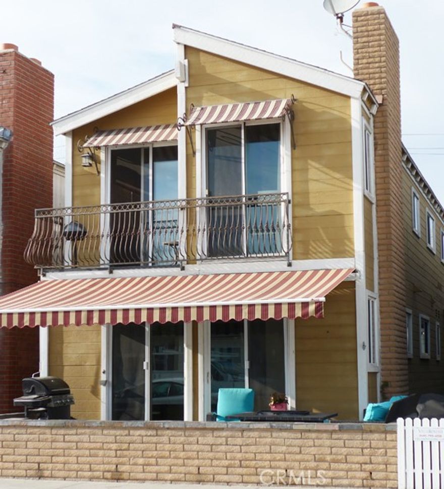 Prime Location!!  Spacious 2 bed, 2 bath lower unit of duplex, modern finishes including chef's kitchen, large walk in shower, wood and tile flooring, ceiling fans, fireplace, modern window treatments in most rooms, and front street patio, washer/dryer.  Located minutes away from shopping and ocean access.