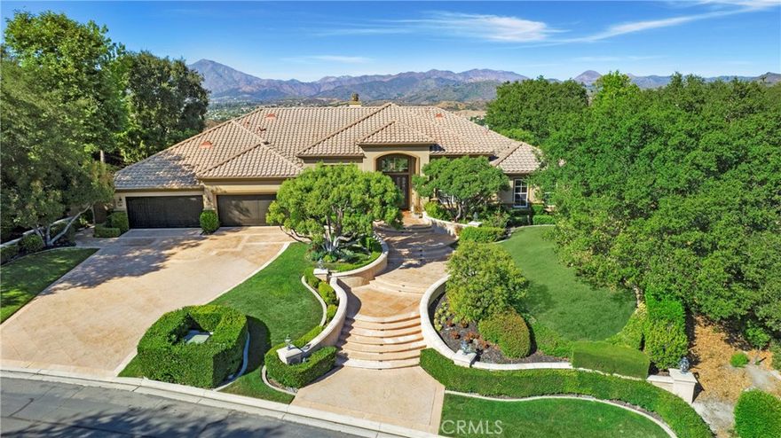 Situated in the guard-gated community of Coto de Caza, this single-level residence exemplifies exceptional design with ridge-top views. Nestled on nearly an acre of land, with a panoramic view of Saddleback Mountain, Cleveland National Forest & the Coto de Caza Valley. The well-designed floor plan boasts 13-ft ceilings, travertine flooring & custom woodwork that creates a sense of luxury. The LR & DR provides a sense of grandeur with a cast stone floor-to-ceiling fireplace and French doors overlooking the pool and expansive backyard. A stunning walk-in wine room built by Vista Wine Cellars centers the home. Enter through Hubbard custom iron doors to Venetian plaster walls, handmade floor tiles, and accented with Idaho Quartz stone. The temperature-controlled room with a separate wine refrigerator for white wine, detailed cabinetry, and seating is one of a kind. The chef's kitchen is a culinary masterpiece, boasting a Sub-Zero refrigerator, Viking 6-burner range with griddle and an abundance of cabinetry. The kitchen nook with backyard view and countertop seating joins the FR with Idaho Quartz stacked stone fireplace, wet bar, and impressive sound system. The finely appointed Primary suite with and backyard access is sure to impress. The Primary Bath w/ skylights for all day natural light, dual vanities, jetted tub, and large walk-in shower, dual commode areas are connected to a walk-in closet. Two large secondary bedrooms and a Jack and Jill bath complete this wing of the home. An additional large bedroom (currently being used as an office) with a private bath and backyard access offers versatility as an in-law suite or bonus area. The breathtaking backyard oasis takes full advantage of the mountain and valley view. The Pebble tech pool & spa centralizes the generous patios. Stone accented BBQ cooking area with the most impressive backdrop, dazzling all your guests! An elevated fire pit is perfect for those nighttime gatherings. Large California oak trees, a grass area & a vegetable garden complete the backyard. 4 garage with epoxy flooring (2-car garage being used as a wood workshop). This residence epitomizes the finest of Coto living, offering access to biking & hiking trails, parks, & sports courts. Residents also have the option to enjoy the amenities of the Coto de Caza Golf & Racquet Club for an additional fee, which features two Robert Trent Jones Jr.-designed golf courses, tennis courts, pickleball courts, a spa, a gym, pro shops, and restaurants.