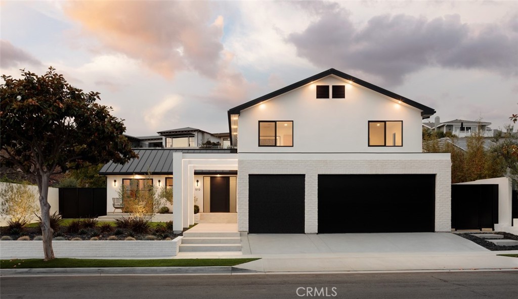 Introducing 919 Sandcastle Drive, a newly reimagined coastal masterpiece in the prestigious Harbor View Hills South community of Corona del Mar. This 5-bedroom, 4-bathroom home has been meticulously rebuilt and reimagined, offering luxurious living on this unique and expansive lot, sprawling over 12,000 square feet. As you step inside, you'll be captivated by the custom high-end finishes, from the exquisite stonework to the elegant wood details. The contemporary design flows seamlessly throughout the home, creating a harmonious blend of sophistication and comfort. The space from the kitchen to the living room is truly amazing, offering a perfect flow that enhances both daily living and entertaining. The heart of the home is its open-concept living area, where the gourmet kitchen, with top-of-the-line appliances connects beautifully to the living space. The tasteful design of the home is evident in every detail, creating an ambiance of understated elegance. The spacious backyard is a true oasis, complete with a putting green and ample space for outdoor gatherings and sauna room with a full bath adding versatility for guests. The second level of the home offers ocean views, providing a serene backdrop to your daily life. With a 3-car garage and every detail thoughtfully considered, this home is a rare find in one of Corona del Mar's most sought-after neighborhoods. Don't miss the opportunity to make 919 Sandcastle Drive your new coastal retreat. Enjoy easy access to the famous Corona Del Mar beach, exclusive shopping venues, and the renowned Pelican Hill resort and Fashion Island, all within a short distance. This stunning home is a testament to refined living and unparalleled style.