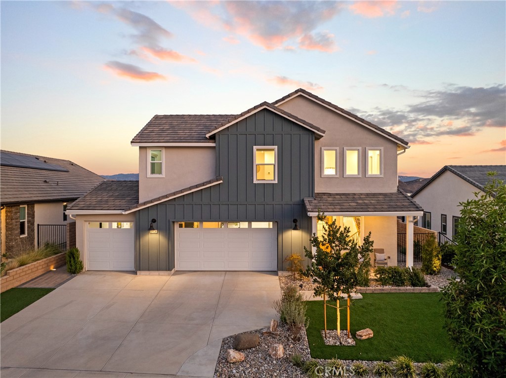 PRICE IMPROVEMENT! Beautifully upgraded two-story home is part of the sought-after Meadow Collection and offers nearly 180-degree panoramic VIEWS and over $120k of incredible upgrades throughout. The spacious layout features 3 bedrooms, a generous multi-purpose loft, 2.5 baths, and 3 car garage. The open-concept kitchen with beautiful cabinets and a gorgeous center island flows seamlessly into the family room, where triple sliding doors lead to a covered patio, perfect for entertaining. As you venture upstairs, the steel baluster staircase wraps around an elegant custom chandelier. The primary suite features a spa-inspired en suite bathroom with an oversized shower, dual sinks, a spacious walk-in closet, and a multi-slide door leading to a private balcony with stunning views. The custom landscaped front and back yards feature artificial turf, concrete tile, lush lawn, river rock, ambient lighting, a resistance swim pool, and a relaxing jacuzzi, all on an incredible lot ideal for celebrations or quiet evenings at home. Additional highlights include luxury vinyl plank flooring downstairs, an upstairs laundry room, custom lighting fixtures, automatic window shades, ceiling fans, a tankless water heater, and PAID solar. Set within a master-planned community surrounded by the Sierra Pelona Mountains, near shopping, restaurants, and freeways, Williams Ranch offers a unique blend of tranquility and convenience. Planned amenities include a junior Olympic-size pool, outdoor kitchen, scenic hiking trails, citrus orchards, vineyards, a wine pavilion, pocket parks, and a state-of-the-art recreation center. If you're looking for a modern home with space, style, and stunning VIEWS in a vibrant community, this is the one. Come experience life at Williams Ranch, an exceptional gated community thoughtfully designed with lifestyle and leisure in mind!