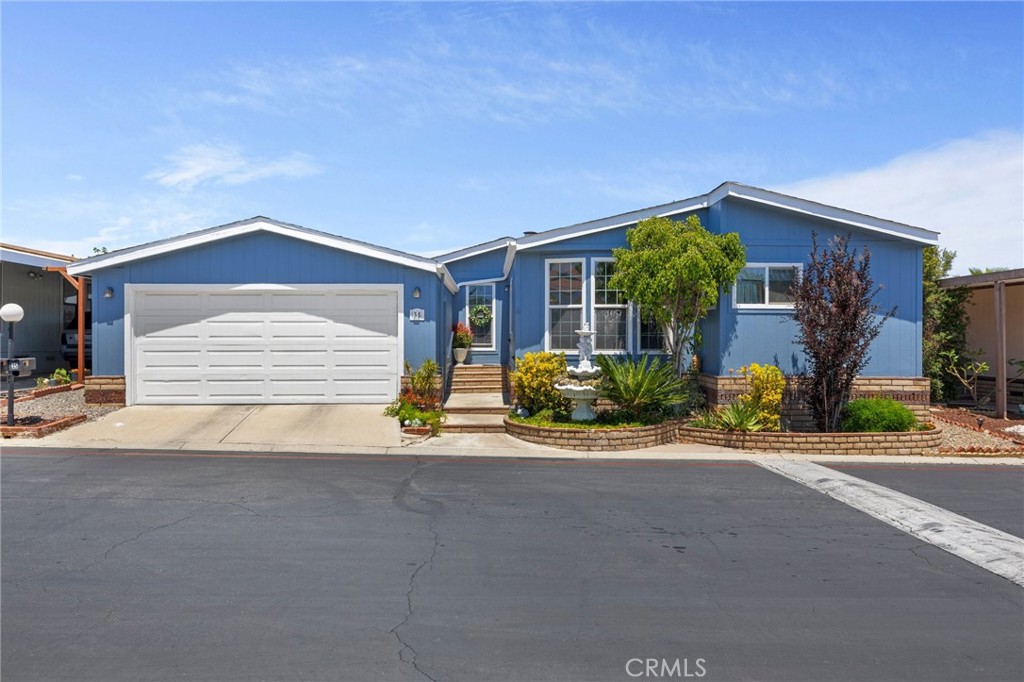 Don’t miss this rare opportunity to own one of the few triple-wide homes in the gated community of Villa Corona in Corona, featuring a two-car garage and a fenced backyard—perfect for added privacy, pets, or entertaining. This beautifully maintained 1983 manufactured home offers 1,692 sq. ft. of living space in a family-friendly park with no age restrictions. Recently updated with fresh exterior paint and a brand new roof, the home features vaulted ceilings, 3 spacious bedrooms, 2 full bathrooms, and an indoor laundry room with plenty of storage throughout. The oversized primary suite includes a large ensuite bathroom with a soaking tub, stall shower, and a separate walk-in closet located directly in the bedroom. Enjoy cooking and hosting in the remodeled kitchen, complete with a pantry and an inviting eat-in dining area that’s perfect for gatherings. Additional upgrades include central heat and air, new dual-pane windows, and a large covered patio in the backyard ideal for relaxing, gardening, or enjoying time with pets. Monthly space rent is approximately $1,200, and utilities are sub-metered. Community amenities include a pool and spa, clubhouse, fitness center, billiards room, BBQ area, EV charging stations, secured RV/boat parking, and a greenbelt dog-walking area. Refrigerator, washer, and dryer are included in the sale. Ideally located between the 15 and 91 freeways and close to shopping, dining, and local attractions, with Centennial High School neighboring the park for easy student access—this is affordable Corona living at its best!