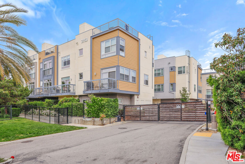 Conveniently located in trendy Silver Lake, is this striking architectural townhouse. Extensively upgraded w/custom cabinets and closets, auto blinds, and privacy enhancing quiet rock drywall. Enter to "flex" space, perfect for home office. Main living area has high ceilings and large sliding doors to balcony. Chef's kitchen features large center island and Viking stove and upgraded appliances. Primary bedroom w/barn door slider, cedar walk in closet, custom built-ins and "peek a boo" views. Elegant bath w/double sinks and walk-in shower. Stunning rooftop entertainment space w/outdoor kitchen, bbq, and views! Attached garage w/EV charge station and new epoxy flooring. Located in Ivanhoe School District,and close to boutiques and restaurants,an absolutely ideal location!