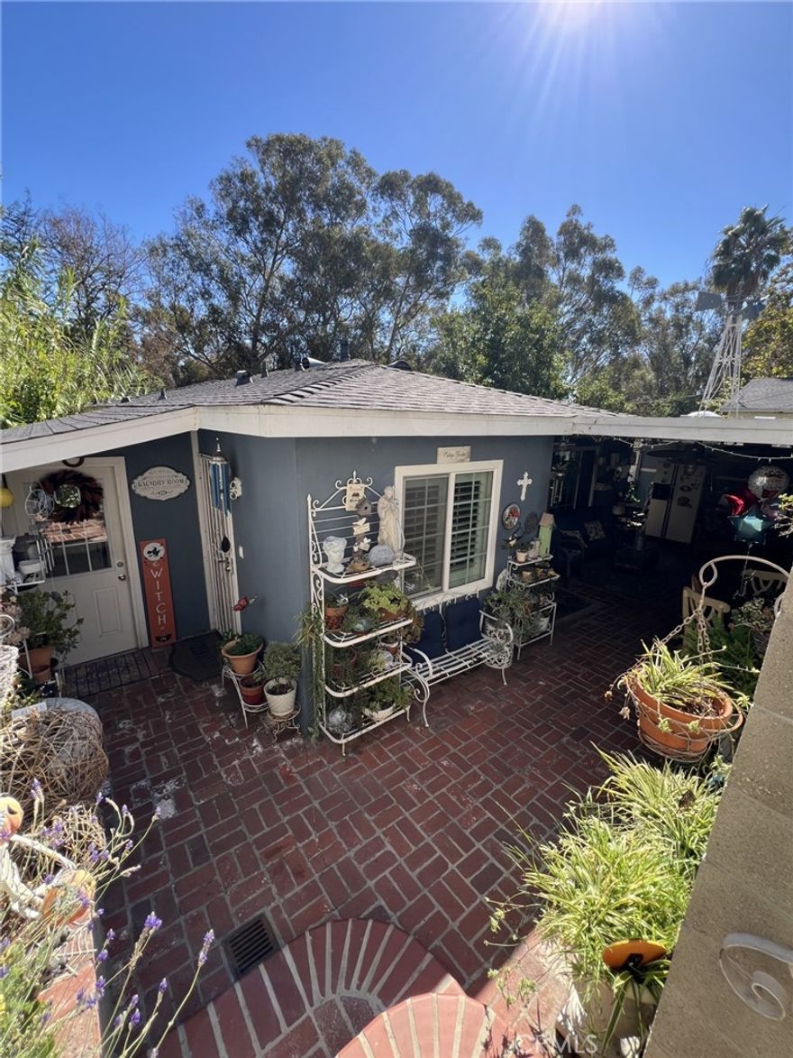 Discover this hidden gem in the heart of El Sereno! Nestled on a beautifully tiered lot, this 3-bedroom, 2-bath home is a true oasis of comfort and privacy. The house sits on a single level. Thoughtfully designed for both relaxation and entertaining, the property features multiple sanctuary decks, covered patios, and an inviting outdoor kitchen perfect for gatherings under the stars. Inside, you’ll find a renovated kitchen with modern finishes, a bright and airy living space, and an enclosed laundry room for added convenience.  Basement can be renovated for additional living space. The peaceful setting offers a unique blend of tranquility and city living, all within walking distance to the university, public transportation, and minutes from Alhambra’s vibrant shops and restaurants. Whether you’re seeking your own retreat or a place to host and connect, this home is special all the way around.