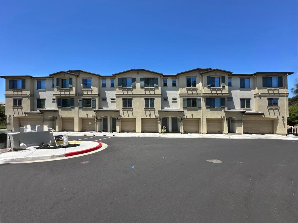 Why Wait for New Construction? Move-In Ready 3-Level Townhome in Prime Martinez Location! Welcome to Muir Heights a stylish and modern community nestled in the heart of Martinez. Built in 2021, this contemporary 3-level townhome offers 1,373 square feet of beautifully designed living space featuring 3 spacious bedrooms and 3 full bathrooms. Interior highlights include premium vinyl plank flooring, recessed lighting, and quartz countertops throughout. The chefs kitchen is equipped with sleek stainless steel appliances, a gas range, built-in dishwasher, and elegant grey cabinetry, providing the perfect setting for everyday cooking and entertaining. Step outside onto your private balcony, ideal for morning coffee or evening relaxation. The home also features a spacious tandem garage with plenty of storage space and a Tesla charger option. Families will love the proximity to John Swett Elementary School, rated 7/10 on GreatSchools, offering strong educational opportunities for young children. Enjoy community amenities like a lush garden, picnic area, and tot-lot great for outdoor fun. Located just a block from Muir Station Shopping Complex, Kaiser and Highways just minutes away, this location is ideal for commuters. Washer / Dryer included. No Rear Neighbors!