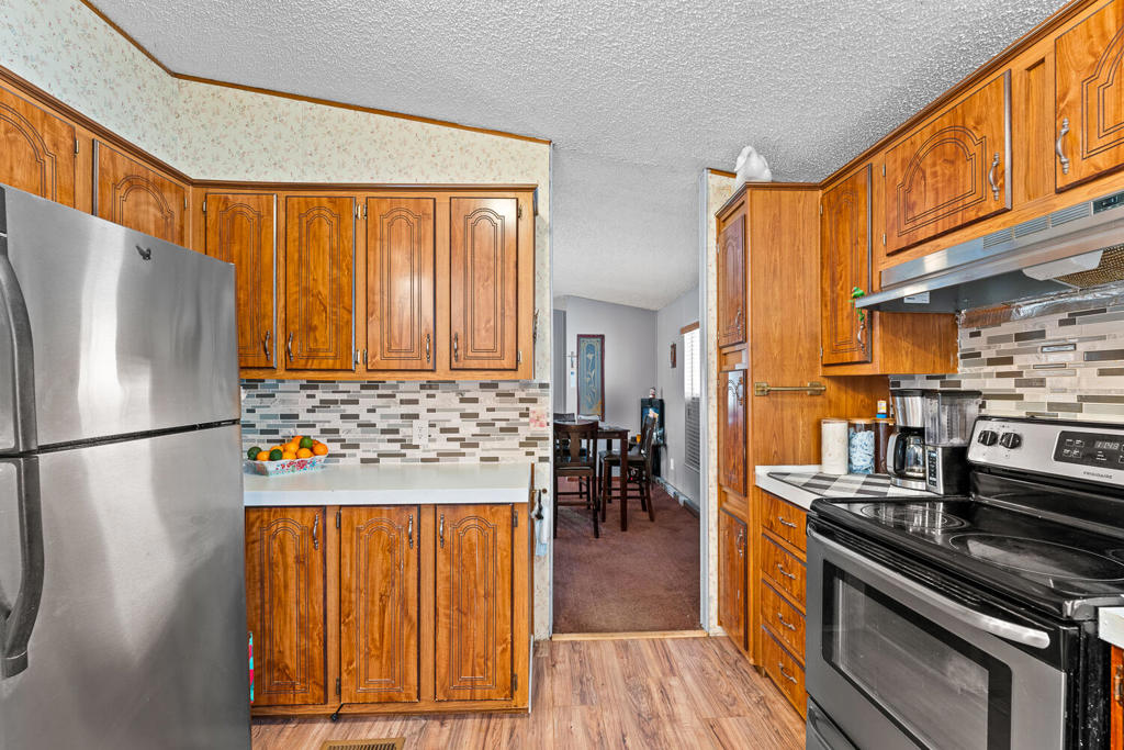 Investor Alert: Fully Financed Opportunity with Strong Rental & Appreciation PotentialSeize this rare opportunity to invest in a fully financeable property with 100% USDA financing available. This well-maintained 3-bedroom, 2-bathroom home sits on a large corner lot and offers exceptional value and long-term stability. Featuring central A/C and four additional window units, the home ensures year-round comfort. The expansive living room and oversized master suite with a private en-suite make this an ideal family rental or owner-occupied investment.Situated on a certified 433A permanent foundation, this mobile home qualifies for traditional financing, adding to its appeal and resale potential. The property includes two RV gates, multiple storage sheds, and ample outdoor space--ideal for tenants with recreational vehicles, hobby needs, or future development ideas.Located near schools and framed by gorgeous mountain views, this property combines lifestyle appeal with strong market fundamentals. Whether you're looking for passive income, value appreciation, or both, this is a must-see investment--schedule a showing before it's gone!