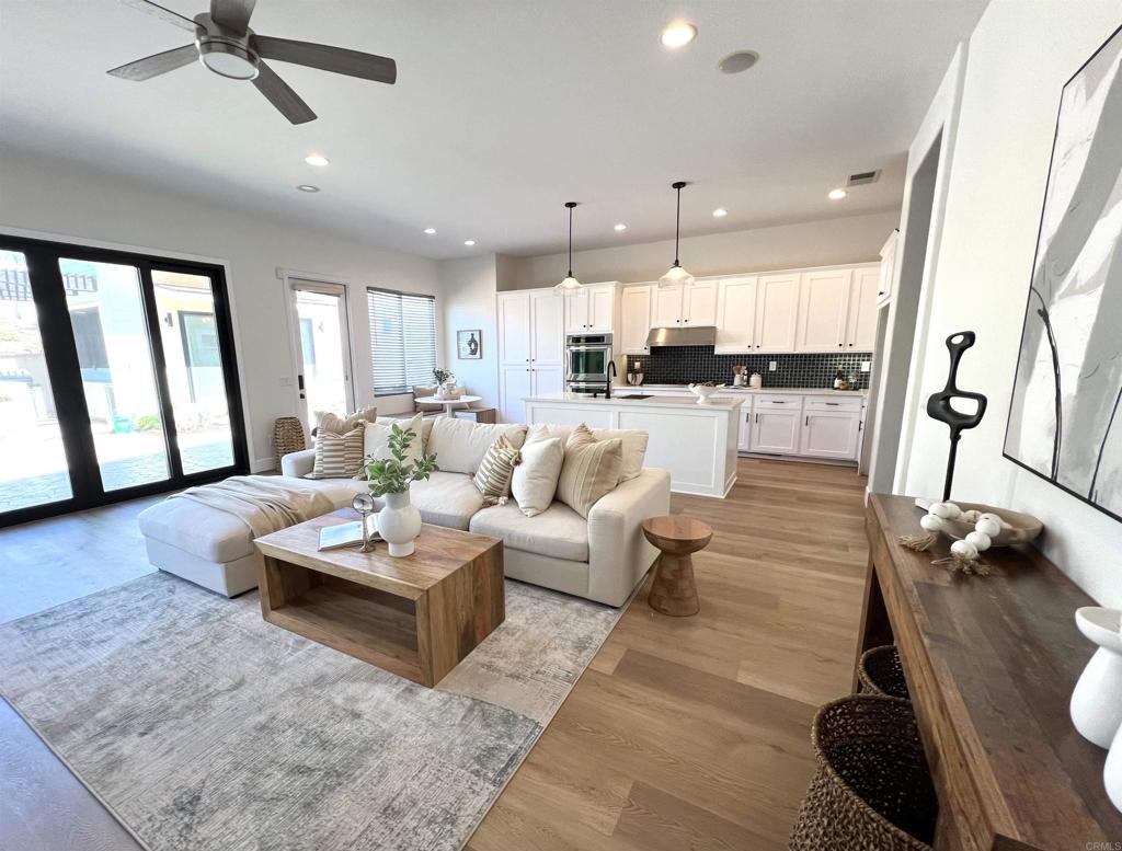 This stunning single-story home has been fully remodeled with modern style and comfort in mind. Step inside to find beautiful wood-style flooring throughout, complemented by newly tiled bathrooms with sleek, contemporary finishes. A glass-enclosed den offers the perfect space for an office, reading room, or creative retreat, while a full workout room brings convenience and fitness right into your home. The property also includes a detached one-bedroom, one-bath guest house complete with its own full kitchen and spacious living room—ideal for extended family, visitors, or rental income potential. Thoughtfully updated and designed for today’s lifestyle, this residence combines functionality, elegance, and versatility in one perfect package. More professional pictures to come online soon