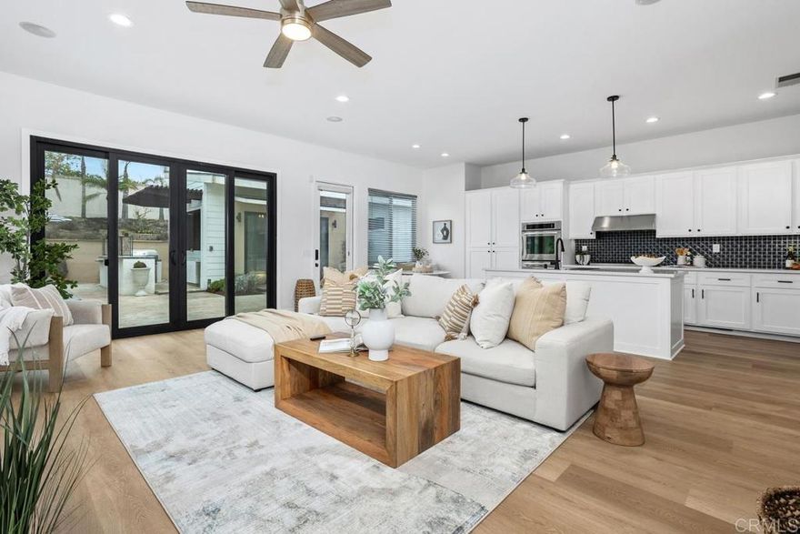 This stunning single-story home has been fully remodeled with modern style and comfort in mind. Step inside to find beautiful wood-style flooring throughout, complemented by newly tiled bathrooms with sleek, contemporary finishes. A glass-enclosed den offers the perfect space for an office, reading room, or creative retreat, while a full workout room brings convenience and fitness right into your home. The property also includes a detached one-bedroom, one-bath guest house complete with its own full kitchen and spacious living room—ideal for extended family, visitors, or rental income potential. Thoughtfully updated and designed for today’s lifestyle, this residence combines functionality, elegance, and versatility in one perfect package.