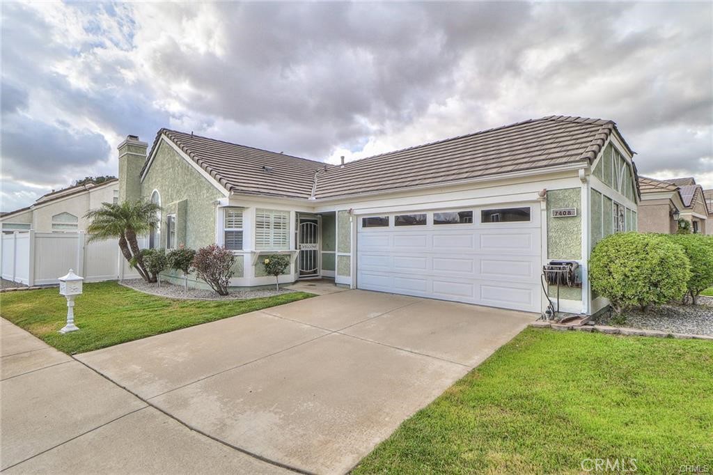 This beautiful 2-bedroom 2-bath single-story home is located within the desirable Terra Vista Neighborhood. This beautiful home has a modern feel which is cheerful, comfortable, and in move-in condition. The kitchen features a built in Banquette seating bench with ample storage underneath. Owners will leave their kitchen table and 2-chairs which are a perfect fit for that eating area. The flooring throughout consists of either wood-like laminate or tile. The interior lighting consists of recessed lights, ceiling fans, and lamp. The living room is large and opens to the patio. The owners will leave their 3 TV wall mounts. All window coverings will stay. The primary bedroom is large with a primary bathroom. The primary bedroom also opens to the patio. The patio is perfect for entertaining, barbecues, or just lounging on a warm summer night. The patio string lights provide extra lighting which creates a cozy ambiance. Additionally, the owners will leave their washer & dryer, kitchen table & 2chairs, seat cushions on the Banquette seating bench, and 3 TV wall mounts. The OWNERS will provide and PAY for the weekly GARDENER. The front and back sprinklers are activated by automatic timers. The OWNERS WILL PAY the property's WATER BILL; all other utilities will be paid by the tenant. The laundry has its own area off the garage; the owners will leave their washer and dryer for the tenants use. The 2-car garage is roomy with an automatic garage door opener and 2-remotes. This charming well-maintained neighborhood displays a true pride of ownership. Located within a well-regarded school district, close to shopping, restaurants, park, major freeway access, and a beautiful large outdoor shopping mall-Victoria Gardens. This home is a must see!