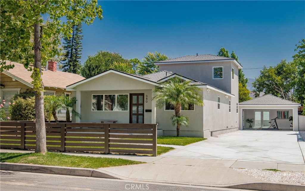 Welcome to 340 N. Mariposa! Nestled on a peaceful, tree-lined street, this beautifully renovated home is a true gem with natural redwood flooring, copper plumbing, 2 HVAC systems and a tankless water heater. Boasting 4 bedrooms, 3 full bathrooms, and 2,185 square feet of living space, it offers both elegance and functionality. Step inside to discover a chef’s dream kitchen, featuring porcelain countertops, sleek new BOSCH appliances, and a welcoming bar area—perfect for entertaining. Just down the hall, you’ll find 3 spacious bedrooms, each with generous closet space. Upstairs, the luxurious primary suite offers a serene escape, complete with a spa-like bathroom and a private balcony with scenic views. It’s a personal retreat you’ll never want to leave. The beautiful french doors lead out to a beautifully landscaped backyard with lush green grass, high-end BBQ, and a cozy fire pit—ideal for relaxing evenings under the stars. The long driveway provides ample space for car enthusiasts, along with RV and boat parking, or a safe playground for kids. The fully finished garage, featuring double-doors to the yard, makes an excellent game room or hangout space. Located just blocks from George Izay Park and Walt Disney Elementary School, this home offers access to award-winning Burbank schools. Enjoy being minutes from major studios like Warner Bros., Disney, and Universal, with shopping and dining options at Downtown Burbank, Magnolia Park, Costco and the Empire Center just a short drive away.