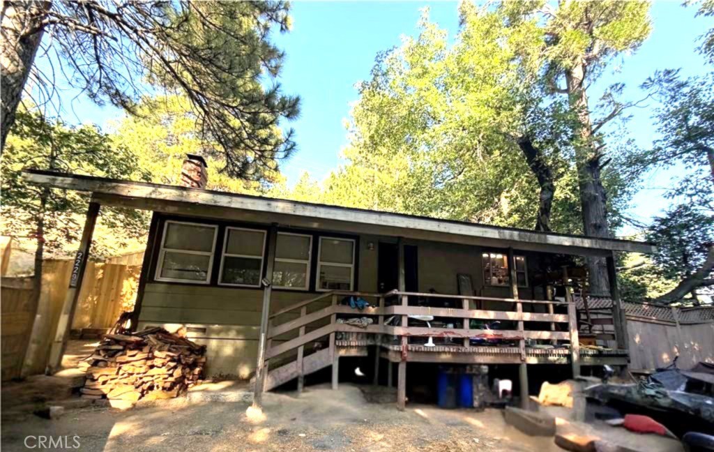 **Welcome to 2229 Spring Oak Drive in Running Springs, CA! This home sits on 1/4 acre lot (10,800 sq ft) and has plenty of off-street parking. The residence has 2 full sized bedrooms and 1 full bathroom. The living space is 945 square feet with an additional 120 square foot front patio/porch. Plenty of room to grow on this lot with a newly installed Wood Fence and a wood-burning fireplace to relax in the warmth of a fire. Exterior Shed gives you plenty of storage and the back yard has plenty of room to have your favorite pet. You are only a short 20 minute drive to San Bernardino, Yaamava Resort and Casino and easy road access during winter months. This home is priced at an exceptional value for a quick sale.
