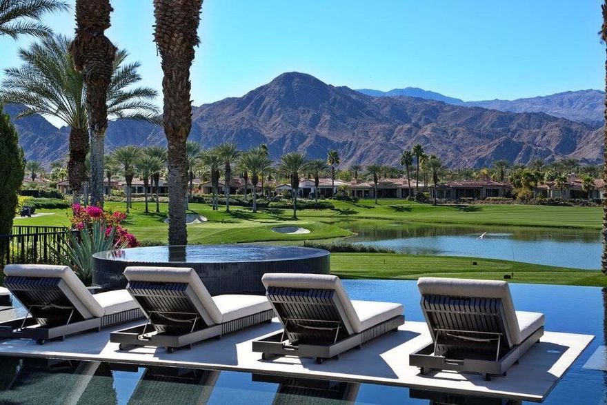 Introducing a unique estate in the exclusive Toscana Country Club, offering breathtaking panoramic views of the club's south-course and majestic mountains. This property is an ideal retreat for those seeking elegance and tranquility. The home underwent an extensive exterior renovation in Fall 2023, transforming it into a masterpiece. Designed by Seattle-based architect Regan McClellan, the backyard features a custom zero-edge infinity pool and spa, blending water and fire elements. The eclipse-shaped pool mirrors the fire pit pad, while stepping stones lead to a lounging pad submerged in just a quarter-inch of water, creating a floating effect. The outdoor space also includes stunning landscaping, custom hardscapes, and a redesigned front walk-up, completed by West Coast Builders and Mirador Landscape. Recognized as one of the ''Greatest Pools of 2024'' by Pebble Technology, the estate's $1.8 million exterior transformation is a standout. The property also boasts a 14.76-kilowatt solar system, producing an estimated 23,000 kWh annually. Newly installed HVAC units ensure year-round comfort. Inside, the home features spacious living areas, elegant finishes, and exquisite Restoration Hardware Outdoor furnishings. The secondary bedrooms are very spacious and thoughtfully designed with beautiful built-ins, offering a perfect retreat for guests. A separate office with stunning views of the South Mountains overlooks the pool and outdoor area, providing an inspiring space to work. This ultra-luxury home offers modern amenities, dramatic views, and an extraordinary outdoor oasis, making it the height of Southern California living.