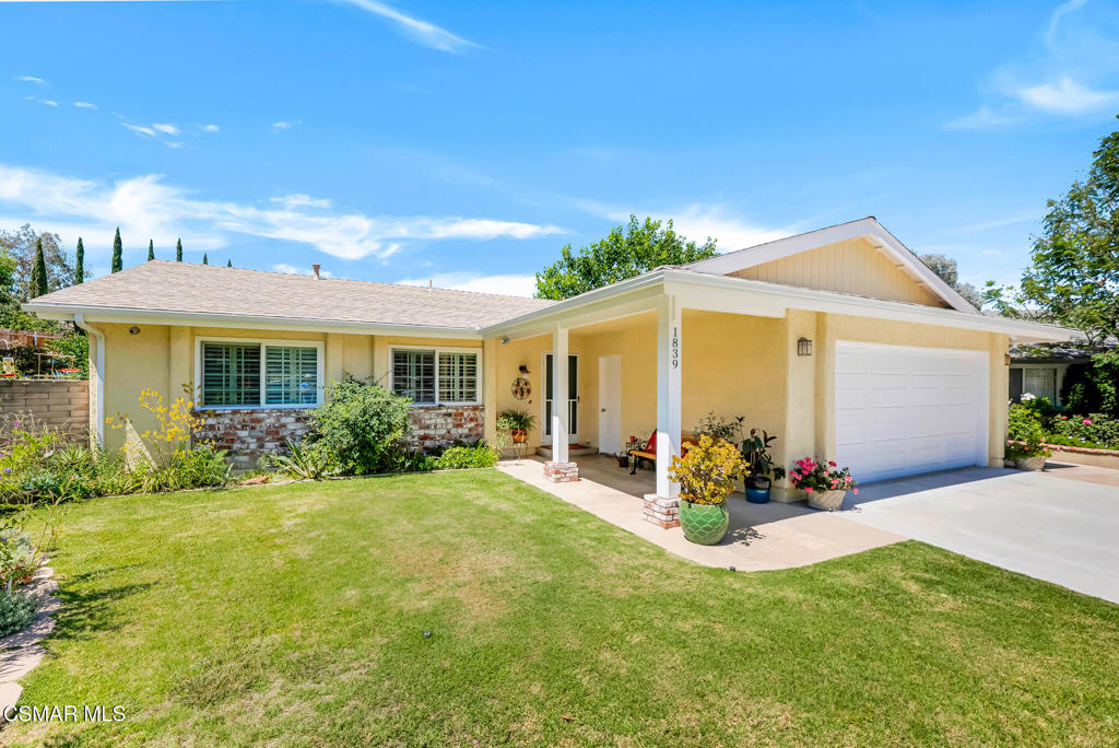 Cape Cod charm across from Foothill Park! Resting at the end of a scenic East Simi Valley ''Golden Valley'' cul-de-sac and directly across from Foothill Park, this Cape Cod-style single-story home offers 3 bedrooms, 2 baths, and nearly 1,200 sq. ft. of living space on a generous 7,900 sq. ft. lot. With its welcoming curb appeal, hillside views, and nearby trails and green space, this home offers a lifestyle that blends nature and community. The park itself offers a basketball court, picnic area, large grassy field, swings, and a playground--all just steps away. Inside, vaulted ceilings and abundant natural light enhance the open living and dining area, where a sliding glass door extends the space outdoors. The updated kitchen is a highlight, finished with white soft-close cabinetry (including pull-outs and glass-front display cabinets), Caesarstone countertops, a decorative tile backsplash, under-cabinet lighting, recessed LED lighting, and Frigidaire stainless steel appliances--fresh, functional, and ready for everyday living or entertaining. The three bedrooms include a primary suite with a walk-in closet, a slider to the backyard, and a remodeled bath with a skylight. Two secondary bedrooms enjoy views of the park, mirrored closet doors, and lighted ceiling fans, and are serviced by a full hall bath with a tub/shower combination. Outdoors, the backyard becomes a private retreat with a covered patio, in-ground spa, and a classic wood-burning fire pit that adds charm and warmth. Succulents, flowering plants, and a mature shade tree add color and texture, while fruit trees and raised garden beds lend a touch of homegrown appeal. A white vinyl fence and rear block wall frame the setting, with views of the Simi Hills as a scenic backdrop. Additional features include dual-pane windows with decorative grids, ceiling fans, skylights, an extra-large driveway with possible RV parking, and an attached 2-car garage (not direct access) with built-in shelving, overhead storage, laundry hookups, and the washer and dryer included. The home also benefits from leased solar panels for added energy efficiency. A rare blend of location, comfort, and charm--ready to welcome you home.