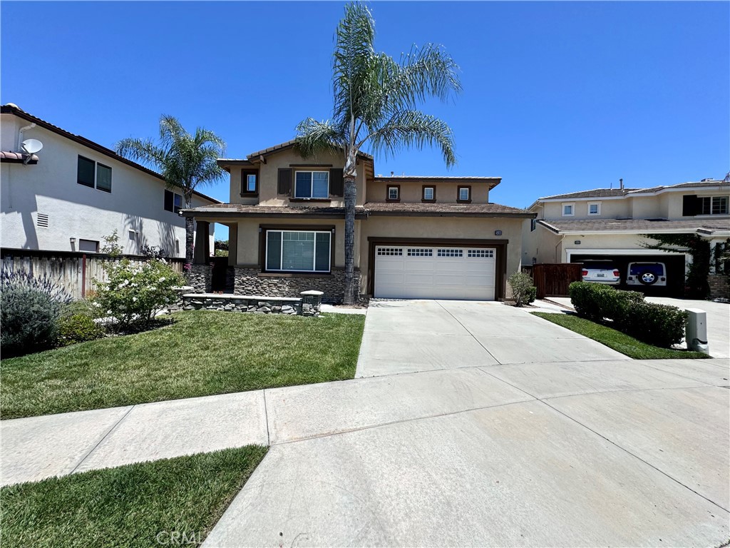 Welcome to your beautiful home in the Copper Canyon community of Murrieta! This expansive 3 bedroom 2.5 bathroom residence with a spacious loft offers over 2300 sqft of living space. As you come inside, you'll be greeted by the grandeur of high ceilings and an inviting light paint scheme that illuminates the beautiful plank flooring throughout. The main floor features a large formal living room, providing ample space for entertaining guests or simply unwinding after a long day. The heart of the home lies in the large kitchen, complete with oak cabinets, granite countertops, stainless steel appliances, an island and seamlessly transitions into the dining area and family room, where a cozy fireplace awaits! Convenience is key with a half bathroom downstairs for guests. Heading upstairs you will discover an oversized loft flooded with natural light, offering endless possibilities for a play area, home office, or relaxation space. Continuing down the hall, you'll find a full bathroom with linen storage, two generously sized bedrooms, and a conveniently located laundry room. Retreat to the beautiful primary bedroom suite, boasting ample space, a lavish bathroom with dual sinks, a large soaking tub, a walk-in shower, and a spacious walk-in closet! The garage provides parking for two vehicles and offers additional storage space with built-in cabinets, ensuring organization is effortless. Venturing outside to the meticulously landscaped backyard oasis, featuring lush greenery, a covered patio, expansive side yards, and the serenity of no rear neighbors. This home is very close to Cole Canyon Elementary School, Parks, Cole Canyon Walking Trails, Dining, Shopping and much more. Schedule a showing today!