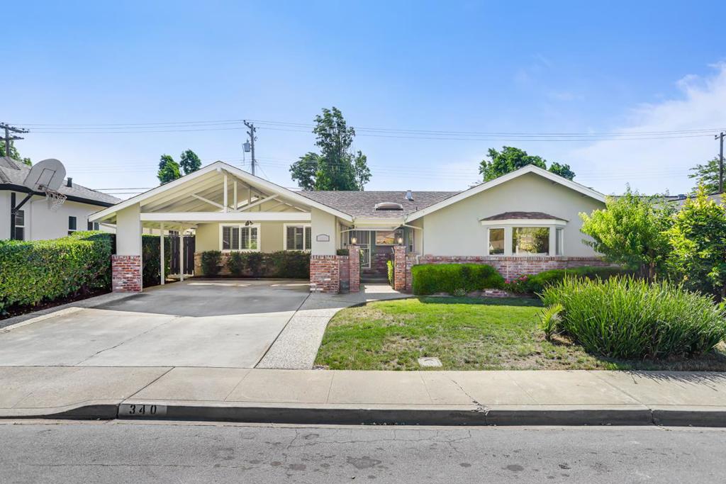 Cupertino Schools: Located on a quiet street in the Westwood Oaks neighborhood, this inviting residence is stylish and spacious home. The home features a separate oversized family room that has cathedral ceilings and an abundance of windows that exude natural light. Flowing seamlessly from the family room is the dedicated dining area and large renovated kitchen. The kitchen boasts modern high-gloss cabinets, sleek white-quartz countertops, and an oversized sink. The living room features a wood-burning fireplace and a large sliding glass door that opens to the backyard, where you'll find a delightful covered patio, sparkling pool and mature fruit trees. Retreat to the bedrooms, each featuring mirrored closet doors and charming plantation shutters, offering both privacy and a touch of sophistication. The bathrooms have been remodeled with modern styling and fixtures. The home also features fresh interior paint, new hardware, and updated lighting fixtures throughout. You will have the convenience of an inside laundry room, central heating and cooling, double-pane windows, and a large two-car carport. Enjoy close proximity to beloved neighborhood parks like Westwood Oaks Park and Jenny Strand Park. Easy to Lawrence Expressway and Highway 280, and walking distance to Apple HQ.