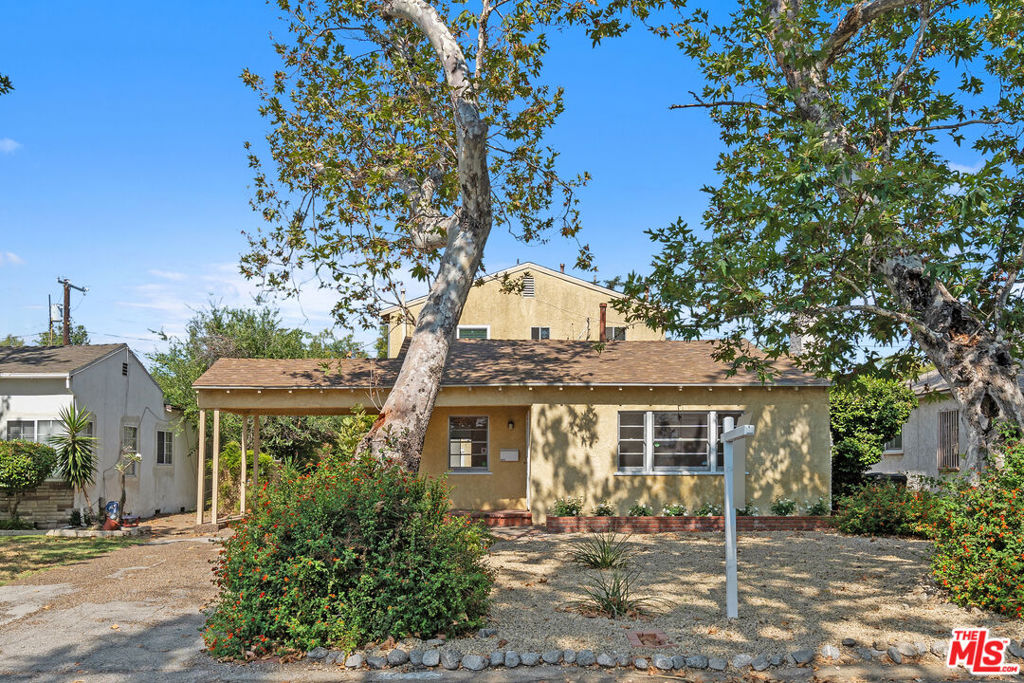 Discover the endless potential of this charming two story 5-bedroom 2-bath pool home, nestled on a picturesque tree-lined street. Lovingly maintained over the years, this property offers a rare opportunity to re-imagine and create a dream home in one of Los Angeles' most vibrant neighborhoods. Cozy living room with a decorative fireplace and an adjoining dining area. The galley kitchen seamlessly opens to the family room, where sliding doors lead to a large backyard. Two bedrooms and a full bath on the main level, while 3 additional bedrooms and a second bathroom are located upstairs. Enjoy quintessential California living with a spacious backyard featuring a pool and spa. A long driveway leads to a generous detached garage that may be transformed into a pool house, creative studio or income-generating ADU. Ideally located just minutes from shopping, dining and entertainment, this home offers unbeatable location combined with income potential. Bring your vision, this is a must-see!