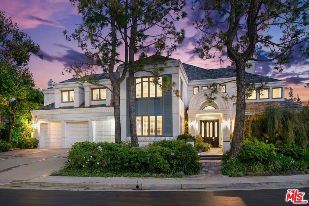ENTERED IN THE MLS FOR COMP PURPOSES ONLY. Airy, grand and beautifully refined, 2496 Lancelot Lane enjoys a prime location within Bel Air Crest, an exclusive gated neighborhood set high above the city yet just minutes from Beverly Hills' iconic shops and restaurants. Set across 9,079 square feet on more than half an acre, this four-bedroom, six-and-a-half-bath estate is one of just four homes in the entire enclave that offers a stunning ocean view. Plus, it's conveniently located across the street from the community's clubhouse, which is equipped with a fitness center, swimming pool and three tennis courts. Past an enchanting garden entry with a koi pond, find interiors that present expansive living spaces that fuse sleek contemporary design elements with elegant, timeless details. Features include a sparkling chef's kitchen with stainless steel Viking appliances, soaring ceilings, large light-capturing skylights, polished stone and wood floors, multiple fireplaces, a bar room, office, maid's room, indoor sauna and a gracious primary suite with dual vanities and closets as well as a steam shower and jetted tub. On the main level, walls of accordion glass doors open to the park-like backyard, which boasts a gazebo, grassy lawn and multiple spaces designed for lounging and stylish al fresco dining. The resort-like heated, saltwater pool is complete with waterfalls. Breathtaking views from the home and backyard sweep across the canyon, city and the Pacific beyond. Additional home features include a three-car garage. Private, inviting and polished, 2496 Lancelot Lane captures the best of Bel Air living within a coveted gated community.
