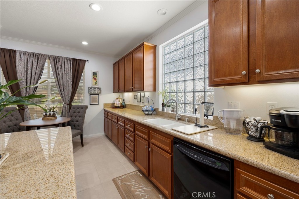 Welcome to 126 Thistle Creek in the highly desirable guard-gated 55+ community of Four Seasons at Beaumont, where resort-style living meets the comfort of one of the community’s most sought-after floor plans, the Monarch I. This single-story home offers approximately 1,442 square feet of thoughtfully designed living space with 2 bedrooms, 2 bathrooms, and an attached 2-car garage. The inviting front courtyard leads you into a light-filled open great room that seamlessly connects to the dining area and spacious island kitchen with granite counters, abundant cabinetry, and recessed lighting, perfect for both everyday living and entertaining. The popular split-bedroom layout provides privacy, with the primary suite featuring a generous bathroom and walk-in closet, while the secondary bedroom and bath are ideally located for guests or use as an office. Additional features include crown molding, neutral finishes, and a low-maintenance backyard patio that extends your living space outdoors, with front yard landscaping conveniently maintained by the HOA. Four Seasons at Beaumont is renowned for its resort-caliber amenities including The Lodge clubhouse, multiple indoor and outdoor pools, fitness center, tennis and pickleball courts, walking trails, billiards, ballroom, and a vibrant calendar of clubs and activities, all designed to enrich an active lifestyle. The community’s location offers quick access to shopping, dining, golf, and major freeways, with the charm of Redlands, mountain escapes, and Palm Springs just a short drive away. Don’t miss the opportunity to own this beautifully kept home in one of Beaumont’s premier active-adult communities where the floor plan, amenities, and lifestyle are second to none.