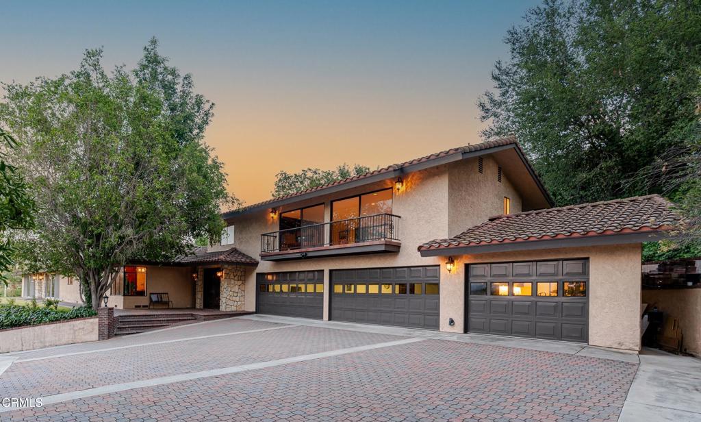 Perched above the treetops in the prestigious South Hills neighborhood, this custom mid-century estate was made for entertaining and offers sweeping views of the valley and mountains beyond. Spanning 4,384 SF this showcase home includes 4 beds, 4 baths and combines timeless craftsmanship with modern comfort. Enter through the private gate and up the long driveway to find a spacious motor court plus a five-car garage. Just inside the striking double-door entry lies a two-story foyer with custom woodworking that makes a dramatic first impression. The adjacent family room features a bold, unique suspended fireplace, while a nearby guest bedroom with a wall of attractive built-in shelving functions as a private office. At the heart of the home, the chef's kitchen boasts an oversized center island, premium appliances, and a dining area, and flows into the formal dining room with a cozy stone fireplace and sweeping views. The east wing holds a formal living room with a wall of sliders and a third fireplace, while the south wing offers two guest bedrooms and a guest bath. The primary suite is a true retreat with dual walk-in closets, sitting area, updated ensuite bath, and serene views. Upstairs, the loft is a versatile entertaining space with wet bar, fireplace, and built-ins - perfect for intimate gatherings, game nights, or enjoying city light views. Close to the South Hills Country Club, dining, shopping, and schools, this elegant estate is one of a kind!