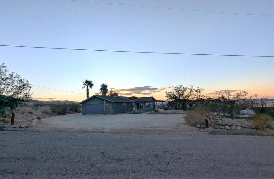 Let this home be your escape to the beauty of Joshua Tree with this desert home. With 4 beds and 3 baths, you'll have plenty of room for entertaining. This place has it ALL; a potential RV garage currently used as a game/ entertainment area with its own rock wall! Enjoy the outside firepit on those summer nights under the expansive star-filled sky with friends and family. Make this your forever home or your home away from home. You wont want to miss this one, it wont last long!To help visualize this home's floorplan and to highlight its potential, virtual furnishings may have been added to photos found in this listing.