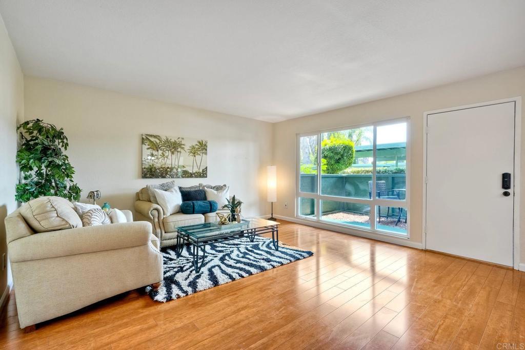 Welcome to the desirable Pepperwood community in East Escondido—VA & FHA approved complex offering exceptional value, comfort, and convenience in a quiet, interior location away from street noise. This property qualifies for up to $15,000 PRIVATE GRANT funds that can be use towards down payment, closing costs or rate buy down! This downstairs unit lives like a SINGLE-STORY home with no stairs, offering ease of access and everyday comfort. Enjoy the convenience of dedicated parking just steps from your front door, plus an additional assigned COVERED parking space—ideal for multi-car households or guests. Total parking spaces is two. The beautifully upgraded kitchen features stainless steel appliances including refrigerator that conveys, granite countertops, newer cabinetry, and recessed lighting—perfect for those who appreciate both style and functionality. The open-concept living area includes fresh interior paint, newer dual-pane windows, central A/C, and access to your own private patio—a peaceful spot to enjoy your morning coffee or unwind after a long day. Both bathrooms include a shower/tub combo, and the layout provides comfortable separation between the bedrooms and main living spaces. Community amenities include two sparkling pools, a spa, clubhouse, and on-site laundry, with HOA dues covering water, sewer, and trash—an excellent value. Ideally located near Oak Hill City Park, within walking distance to the elementary school, and just minutes from shopping, dining, entertainment, and major commuter routes—this home combines everyday convenience with relaxed living. A unique opportunity to make this home your own!