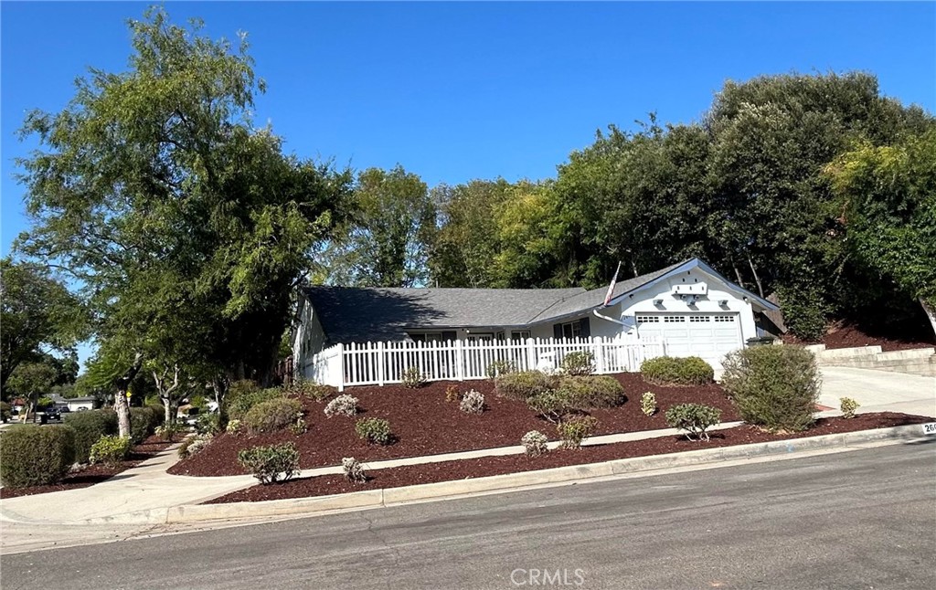 Welcome to this beautifully updated 3-bedroom, 2-bath Traditional home that perfectly blends classic charm with modern amenities. Freshly painted inside and out and newly landscaped, this inviting property is move-in ready and designed for comfortable living and effortless entertaining. Step inside to discover a bright and open floor plan enhanced by rich wood floors and elegant crown molding throughout. The spacious living area features a cozy gas fireplace with a beautiful raised brick hearth—perfect for relaxing evenings or hosting guests in style. The dining area flows seamlessly into the beautifully updated kitchen, which features sleek stainless steel appliances, ample cabinetry, and stylish finishes sure to delight any home chef. Down the hall, the generously sized primary bedroom is a peaceful retreat, offering double closets and a beautifully updated en suite bathroom complete with a double vanity. The two additional bedrooms are light-filled and offer plenty of closet space. Both bathrooms have been thoughtfully renovated with contemporary touches. Step outside to a private backyard designed for both relaxation and play. Enjoy the wonderful patio area—ideal for outdoor dining or entertaining—alongside a lush grassy lawn and a designated play area featuring a fun jungle gym. Unwind under the stars in the above-ground saltwater hot-tub/spa, the perfect way to end your day. This beautiful home is ideally located just minutes from shopping, dining, Cal State University Fullerton, and multiple golf courses. Nature lovers will rejoice in the proximity to the Fullerton Reservoir and Panorama Preserve, where fishing, hiking, picnicking, and birdwatching await just moments from your door. With its warm, timeless details, fresh modern upgrades, and an unbeatable location, this home is truly a standout. Don’t miss your opportunity to own a turnkey property with exceptional style, comfort, and convenience!