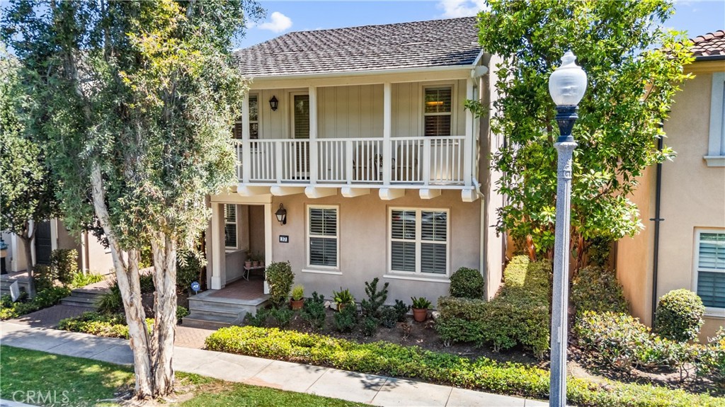 Located on a quiet interior street, this popular Monterey Plan 3 in the master-planned community of Woodbury East showcases architectural sophistication, highlighted by abundant windows and doors, an inviting front porch, and a charming courtyard. Adding to its curb appeal is a rarely seen upper deck that enhances the handsome front façade and distinctive architectural character. 3 bedrooms, a den, & 2.5 baths, with high-end custom upgrades at every turn. As you enter, timeless staggered travertine flooring flows throughout the entire first floor. Brand-new carpet on the staircase and second floor was carefully chosen for both elegance and comfort. A light-filled, expansive living room opens to a gourmet kitchen with a large central island. Situated at the heart of the home, the kitchen boasts granite countertops, a full backsplash with glass and natural stone mosaics, custom cabinetry with glass-paneled doors, and stainless steel appliances. Fresh interior paint, including baseboards and walk-in pantry shelves. The spacious dining area features a sliding glass door, opening to an enchanting courtyard, beautifully landscaped with staggered tiles, mosaic accents, & fruit trees—perfect for indoor-outdoor living. The primary suite includes a private deck and a luxurious ensuite bath, upgraded with marble countertops, a marble tub surround, and a walk-in shower. Mirrored closet doors & high-end built-in closet organizers in all 3 bedrooms. A den by the front entry is ideal for a home office. LED recessed lighting with dimmers in every room, plantation shutters, crown moldings, 2 NEST thermostats, & keyless entry for both the front and garage doors. The garage is fully finished with epoxy flooring, an EV-compatible outlet, and custom cabinetry throughout—including built-in shoe shelves. Multiple outdoor areas are perfect for plant lovers or those who enjoy outside. Unwind on the covered deck after a long day, dine under the stars in the courtyard, or showcase your favorite flower pots on the welcoming front porch. World-class HOA amenities, including multiple pools, spas, sport courts, a fitness center, clubhouse, tot lots, and more. The Monterey Neighborhood Association also maintains the front landscaping, exterior paint, roof, and termite work—an ideal setup for busy homeowners. Located within the award-winning Irvine Unified School District, with easy access to freeways and just minutes from Woodbury Town Center, the Great Park, Irvine Spectrum, and more.