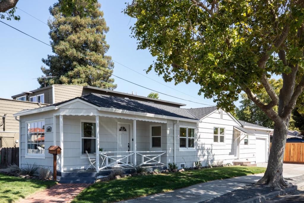 Charming 2BD/1BA home on a sunny corner lot in the heart of Redwood City. Surrounded by mature trees and lush landscaping, this light-filled gem features hardwood floors, a welcoming covered front porch, and a flowing floorplan. The spacious living room boasts large windows and abundant natural light. Enjoy cooking in the updated kitchen with granite countertops, glass-front cabinets, stainless steel appliancesincluding a gas range, Bosch dishwasher, and built-in microwave. A generous laundry room adds bonus storage and a convenient side entrance from the garage. Bedrooms and bath are tucked away on a private hallway, offering quiet retreat. Ideally located near Woodside Rd with easy access to 280, 101, and El Camino Real. Close to schools, shopping, dining, and the Magical Playground at Red Morton Park. A timeless, move-in-ready home in an unbeatable location!