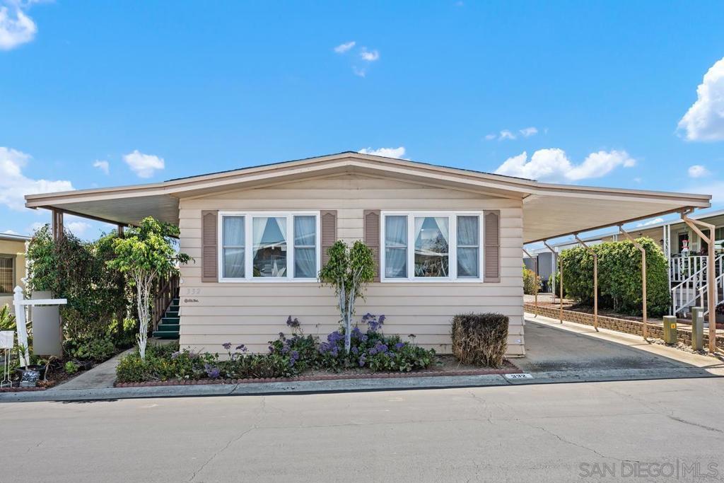 Come see this Cozy Manufacturer home. Very beautiful community, that boasts a clubhouse, and Pool. Two very spacious rooms, that include a very spacious Sunroom attached. Kitchen has been upgraded, and flooring is immaculate. Two cars fit perfectly in the Covered Car Port, and there is a storage Unit as well. Washer and Dryer is included with all of the other appliances as well. This unit is in pristine condition, and very well priced! If you want to enjoy beach time, you are literally 20-minutes from the Ocean! Sky lights compliment the living space, and the unit has a beautiful Fire place. Come see this, as it will not last!