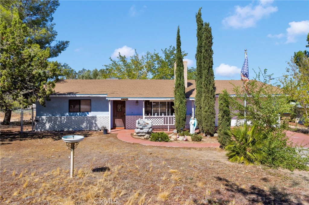 Check out this home with a great location. Sitting on just over 1/2 an acre on corner lot. 2 bedrooms 1 bath, large living room with wood burning stove for those chilly nights. Kitchen with refrigerator included. 2 car attached garage with washer/dryer. Covered patio, large mature trees for added privacy, fenced and cross fenced. This house is ready to be your home! And check out the price! Make an appt to see it TODAY!
