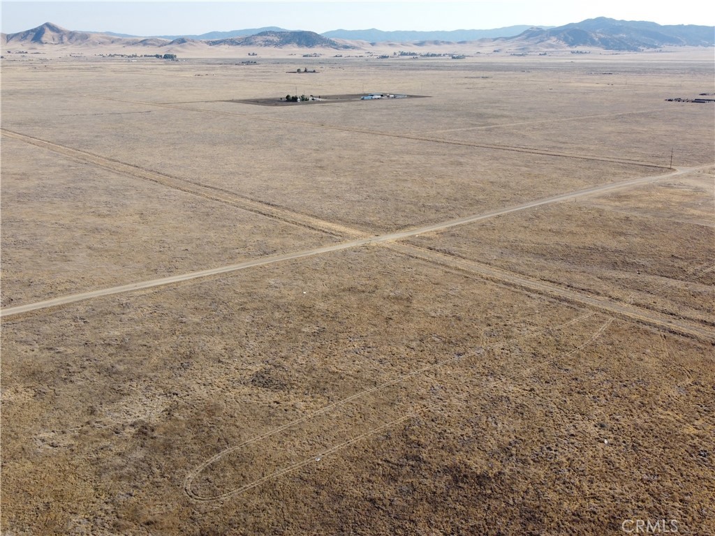 Embrace the simplicity and freedom of country living with this inviting 2.5-acre corner lot in California Valley. Ideally suited for a manufactured home, this property offers easy access to power just a block away at the corner, making development more convenient and cost-efficient. Located on maintained gravel roads that are accessible year-round, the land combines practical features with scenic beauty. This versatile land offers lucrative investment potential, with the possibility of future development or appreciation in resale value. Whether you're looking to create a peaceful retreat, cultivate a garden, or enjoy outdoor activities like hiking and horseback riding, this parcel provides space, versatility, and tranquility. Enjoy the freedom of living in the country, making cherished memories, and unlocking the true essence of peaceful living on this remarkable property. COORDINATES: 35.329610, -119.966863