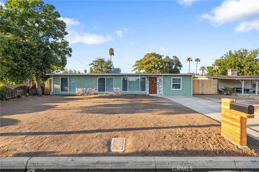 FHA Ready! Mid-Century Modern Gem in North Fresno! This 3-bedroom, 2-bath home is a commuter's delight with a Walk Score of 60. A one-of-a-kind custom property, it's a design lover's dream featuring clean lines, repeating polygon angles, and walls of glass that showcase the thoughtful architecture. Updates include roof, windows, flooring, and more, truly move-in ready! The detached 2-car garage sits toward the back of the lot, offering flexibility for an office, shop, yoga room, or potential ADU. The spacious backyard is perfect for entertaining, with plenty of room for gatherings. Conveniently located just minutes from Trader Joe's, Starbucks, Fashion Fair Mall, parks, and local eateries.