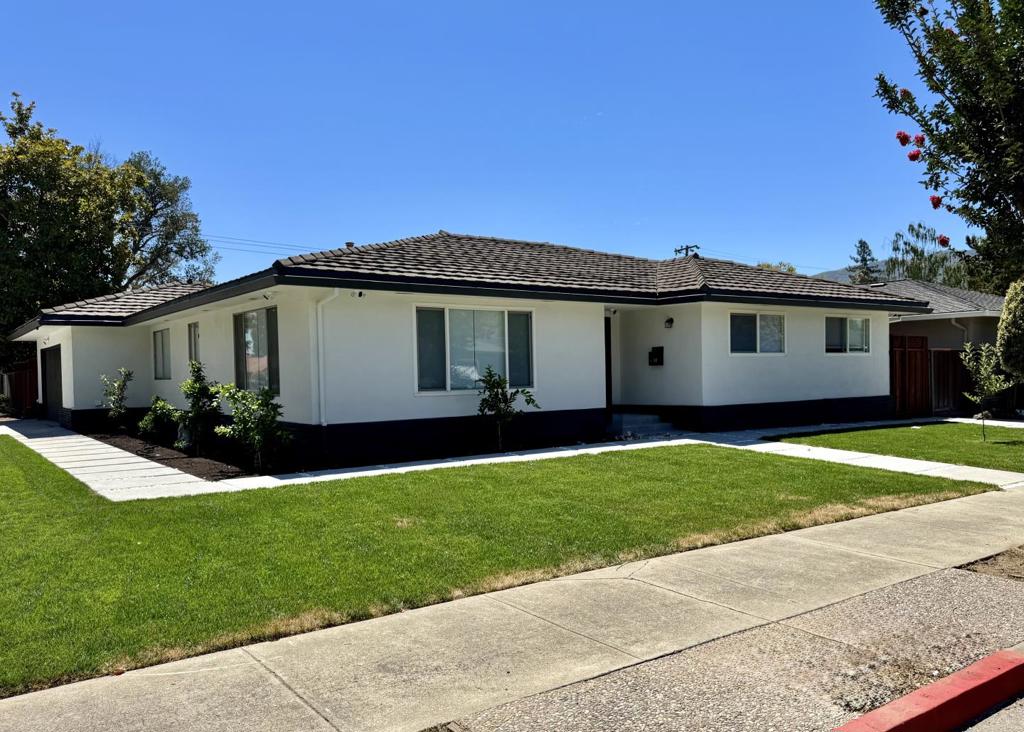 Welcome to this Newly Remodeled, charming 3-bedroom, 2-bathroom home located in the vibrant city of Gilroy. With over 1,700 Sq.Ft. of living space, this property offers a blend of comfort and convenience. The kitchen is a standout feature boasting quartz countertops, island, and new appliances, making it perfect for everyday meals and entertaining. The flooring throughout the home is New, durable, and stylish laminate, providing a seamless flow from room to room. The family room is designed in a kitchen/family room combo layout, complete with a cozy fireplace, ideal for relaxing evenings. The dining area offers multiple options, including a breakfast bar, eat-in kitchen, and formal dining room, catering to a variety of dining preferences. Additional amenities include central AC and heating, ensuring comfort throughout the year. Laundry facilities are conveniently located in the garage, which also offers two parking spaces. This home is situated within the Gilroy Unified Elementary School District. The current owner has an ADU permit in progress to add an extra unit in the massive backyard, making it even more desirable for extra income or multi-family living. The gated access to the backyard allows you to park extra cars, an RV, or just enjoy gatherings with family and friends!