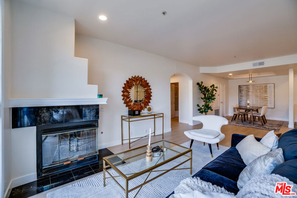 Welcome Home! This beautiful 2 bedroom, 2 bathroom, plus 1 bonus room condo in the heart of Toluca Lake that superbly blends modern luxury, spacious living, and an unbeatable location! Step inside to find new flooring, new custom paint, soaring 9-foot ceilings, two balconies, new recessed lighting, a fireplace, and a plethora of architectural details. The main dining and living areas are expansive and offer natural light! The extra flex area off the living room can be used as an office, den, or hobby room! Both bedrooms offer generous space for sleeping and or added living space. The spacious primary suite yields a generous walk-in closet and an ensuite bath with a separate shower, bath tub, and dual vanities. There's a newer washer and dryer in the unit for convenience that are less than a year old. The Building has secure access to a beautiful open lobby, a garden courtyard with a fountain, a gated underground parking garage with two secured parking spaces, several guest parking spaces, and access to community amenities including a lovely and private pool, sauna, and recreation room. In 2024 the roof and boiler underwent a complete replacement, and the HOA dues include earthquake insurance. Located just minutes from major studios, the NoHo Arts District, Toluca Lake Village, and Universal Studios, this home offers quick access to first class shopping, popular dining, and fun entertainment, while nestled in a quiet, coveted neighborhood that maintains the charm and convenience of one of LA's most desirable communities. The Bloomfield Villas offer you the peace, privacy and the relaxation you deserve!
