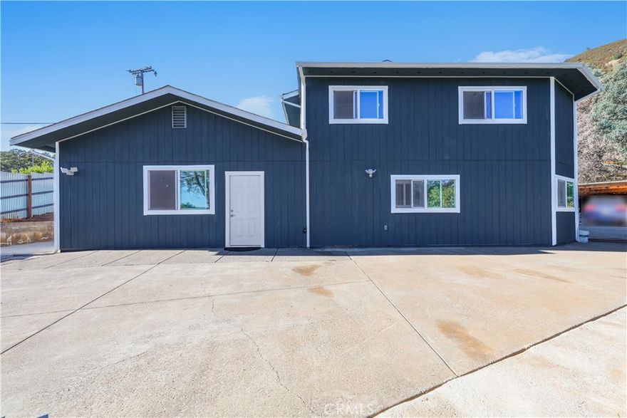 This private single-family home offers stunning lake and mountain views with approximately 3,000 sq. ft. of living space, fully renovated and expanded in 2024 from the original 1985-built 960 sq. ft. home into a modern 4-bedroom, 3-bath residence. Nearly everything is brand new, including interior and exterior walls, roof, water heater, central heating and cooling, bathrooms, kitchen, lighting, vinyl flooring, paint, garage/workshop, and fencing. The home features two interior staircases plus exterior stairs, with bright, spacious corridors that connect seamlessly throughout. A covered backyard room provides flexible options for a bar, BBQ area, gym, or additional garage. Offering excellent privacy, it is ideal for family living, vacation, or leisure, with an easy commute to Ukiah and close proximity to Clear Lake, wineries, and local amenities. County records show 1,982 sq. ft. permitted, with approximately 1,018 sq. ft. of unpermitted corridor/kitchen area, bringing the total to about 3,000 sq. ft.; buyers should verify all square footage and permits with the county or city.