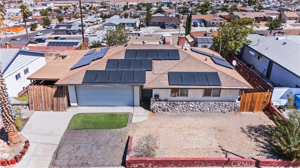 This 4-bedroom, 2-bath home in Barstow offers 1,188 sq ft of interior space on a 6,188 sq ft lot. The layout includes a spacious living area with a brick fireplace, tile flooring throughout, and a kitchen with wood accent finishes and ample storage. The fully fenced backyard features mature trees, a storage shed, and additional space suitable for outdoor projects or recreation. The property also includes an attached 2-car garage and side yard access with room for potential RV parking. Conveniently located near schools, parks, and major commuter routes. Schedule your showing today and explore the potential this property has to offer.
