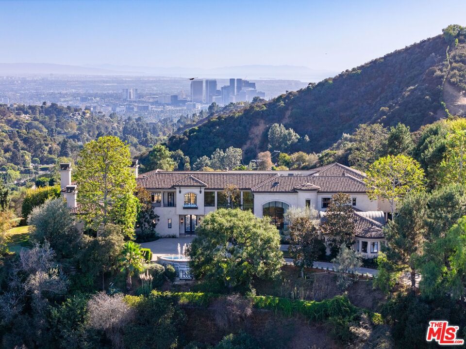 Extraordinary Privately Gated Mediterranean Estate located in the coveted 24-Hour guard-gated Beverly Ridge Estates. Breathtaking panoramic views surround this stunning property. Prominently featuring 6 bedrooms and 10 baths in over 11,000 square feet on 3.96 acres of land. High ceilings and magnificent stone and hardwood flooring ad to the drama of the huge rooms which include a home theatre with covered outdoor lounge, formal living room with fireplace, outdoor family room w/fireplace, den/office, gym and family room. Sensuous primary suite with private balcony, walk-in closet , bath and breathtaking views. Infinity saltwater pool, patios and gazebo w/bar. Detached en-suite guest house. Designed with sophistication and comfort for your most discerning clients. In addition to 3 car garage, 2 car carport, there is an ample motor court for guests. Fit for royalty. Available for one year plus. Contact listing agent for showings.