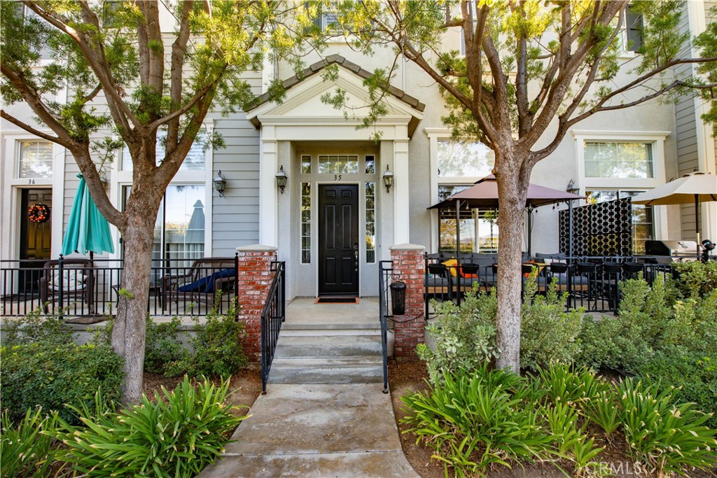 Welcome to 26841 Shorebreak Lane #35, located in the highly desirable Bridgeport community in the heart of Valencia. This beautiful home features a spacious open floor plan with three bedrooms and three bathrooms, offering both comfort and functionality. Upon arrival, you’re greeted by a welcoming front patio, perfect for enjoying tea, lemonade, or a glass of wine—depending on the time of day. Nestled in a serene and picturesque setting, this home is just steps away from Bridgeport Park and Bridgeport Elementary School, making it ideal for families and those who love the outdoors. Step inside to a beautifully appointed living room with vaulted ceilings, recessed lighting, and a cozy fireplace, perfect for relaxing on cool evenings. The kitchen is a true entertainer’s delight, featuring granite countertops, a center island, stainless steel appliances, plantation shutters, and hardwood flooring. The open concept design flows seamlessly into the family room and breakfast area, creating the perfect space for gatherings. Additional highlights include a two-car garage with tandem parking for a third car, a laundry room with a sink and ample cabinetry, and a charming tree-lined street that enhances the community’s tranquil atmosphere. Washer/Dryer and Refrigerator are included. The Bridgeport HOA offers an exceptional lifestyle with resort-style amenities, including a sparkling pool, spa, clubhouse, playground, and basketball court, along with miles of scenic paseos, lush green spaces, and easy access to everyday conveniences. This home truly has it all—comfort, style, and the perfect location to enjoy the best of Valencia living.