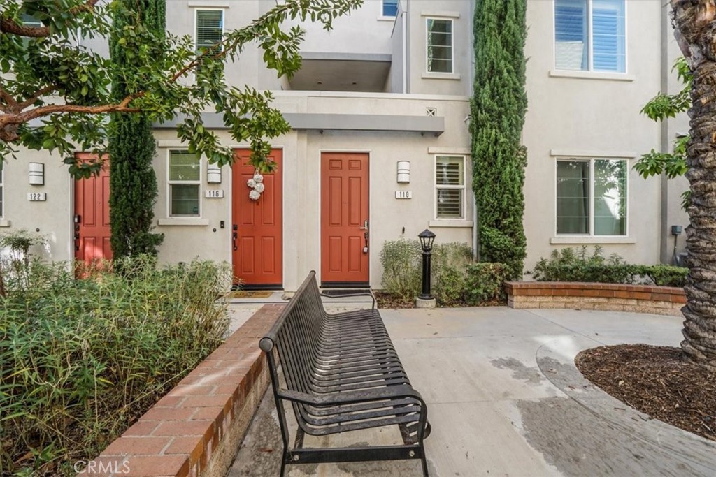 Step into this stylish 3-bed, 3-bath end-unit townhome in the coveted Orchards community. A bright, open-concept layout showcases sun-filled interiors, upgraded vinyl flooring, and a cozy second-floor balcony. Thoughtful touches include an in-unit laundry closet and an oversized two-car garage with a 220V outlet—perfect for EV charging. Commuter-friendly with easy access to the Metrolink, the neighborhood also offers scenic walking paths, a sparkling pool, and a clubhouse. Just minutes from Downtown Upland’s shops, dining, and entertainment.