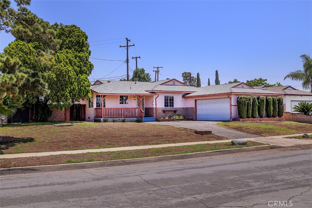 Discover this 1958 single-story ranch home in a pleasant Covina neighborhood. This charming residence offers 1,198 square feet with 3 bedrooms and 2 bathrooms. The interior offers a traditional layout, featuring a galley-style kitchen, an adjacent breakfast nook, a comfortable living room, and a convenient laundry room. Enjoy outdoor living with a quaint front porch and a spacious rear covered patio. An attached garage provides ample parking and storage. Needing some updates, this home is an ideal opportunity for owner-occupants and investors alike. Sold as-is.
