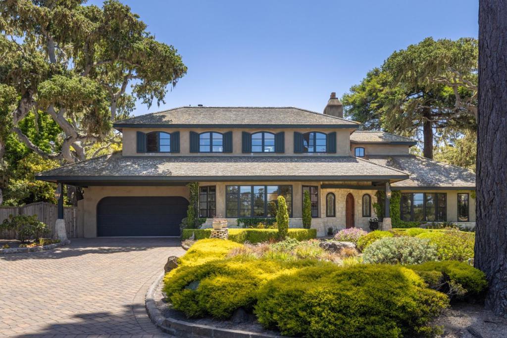 Romantic Pebble Beach home with a European country flair located in the highly desired Country Club West with double fairway views of MPCC Shore Course. Custom built in 2001 by designer David Wilday, this home takes full advantage of golf and ocean views notably including the relaxing sitting area in the artfully landscaped front yard. The back patio with a fountain and fire pit is surrounded by mature trees providing a serene retreat for time alone or entertaining. The inviting floor plan features an oversized kitchen with Wood-Mode cabinets, pantry, center island, abundant storage, granite & limestone counters, and breakfast bar open to the living room with a striking stone fireplace. Formal dining room, separate family room, three bedrooms, and two baths round out the main level. Upstairs is the primary suite with a sitting area, fireplace, two balconies, two sink & dressing areas w/old-growth yellow pine closets, and jacuzzi tub. Other luxury features include plaster walls with natural lime finish, hand-hewn wooden beams, and walnut floors. Tranquility awaits in this very special home offering the perfect Pebble Beach lifestyle just blocks to the ocean and MPCC clubhouse.